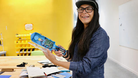 Navajo Technical University student Jonathan Chinana displays the soft robotic gripper he helped develop this summer at the Research Experience for Undergraduates program at SEAS.