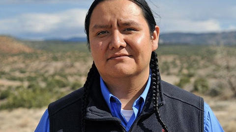 Jason Packineau stands outside Jemez Pueblo in New Mexico.