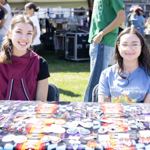 2 students selling at the HUNAP powwow.