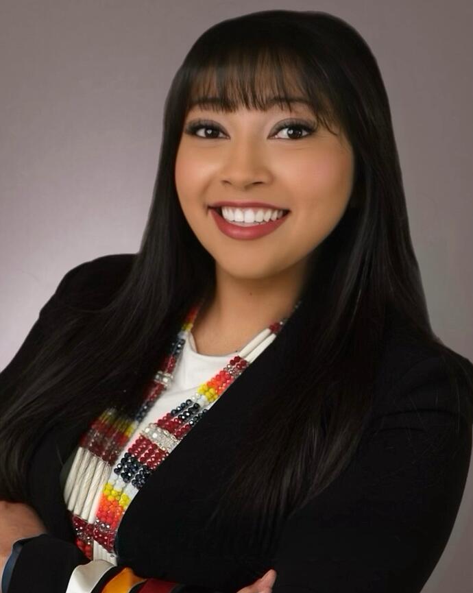 headshot in black ribbon suit